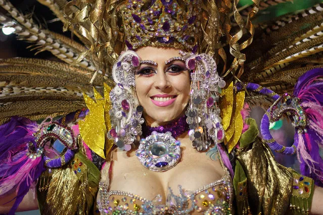 A member of 'Bahia Bahitiare' troupe performs in the troupes dancing contest during the Santa Cruz de Tenerife Carnival on March 1, 2014 in Santa Cruz de Tenerife on the Canary island of Tenerife, Spain. The Carnival of Santa Cruz de Tenerife brings thousands of revellers every year. Santa Cruz is the closest European equivalent to the Brazilian Carnival from Rio de Janeiro.  (Photo by Pablo Blazquez Dominguez/Getty Images)