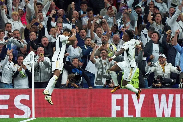 Rodrygo of Real Madrid celebrates scoring his team's second goal with teammate Vinicius Junior during the UEFA Champions League quarter-final first leg match between Real Madrid CF and Manchester City at Estadio Santiago Bernabeu on April 09, 2024 in Madrid, Spain. (Photo by Angel Martinez/Getty Images)