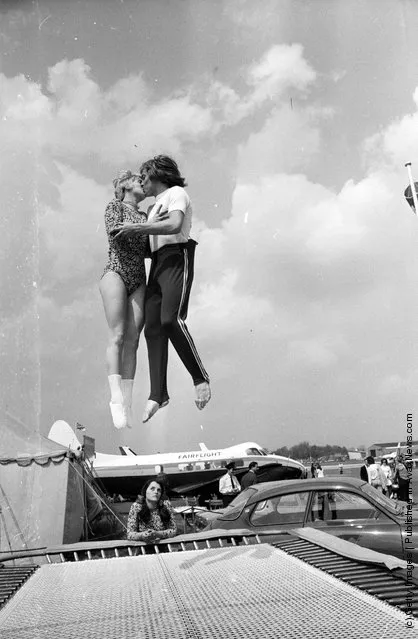 1973: World trampolining champion Paul Luxon and his fiancee, German Ladies Champion Ute Czech, get together for a mid-air kiss at the Biggin Hill Air Fair