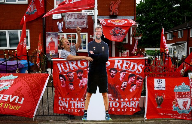 Emily Farley shouts at a passer-by as she decorates her house in Liverpool before Juergen Klopp's final match as Liverpool manager, Liverpool, Britain, on May 16, 2024. (Photo by Carl Recine/Reuters)