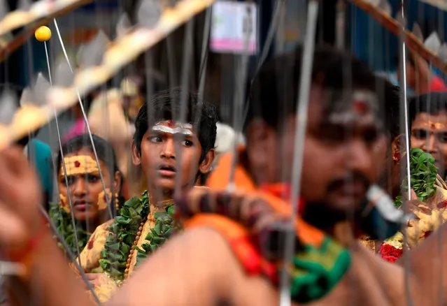 Tamil Hindu devotees with metal rods pierced in their bodies take part in rituals on the occasion of “Aadi” festival in Chennai on July 28, 2019. “Aadi” is considered a holy month by Tamils and is celebrated with rituals worshipping Hindu gods. (Photo by Arun Sankar/AFP Photo)