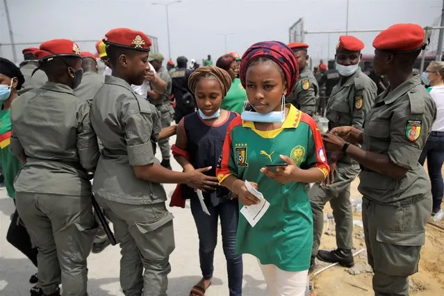 Gendarmerie search Cameroon soccer fans outside the stadium before the African Cup of Nations 2022 quarterfinal match between Gambia and Cameroon at Japoma Stadium, Douala, Cameroon, Saturday, January 29, 2022. (Photo by Sunday Alamba/AP Photo)