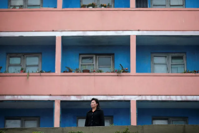 A woman looks towards foreign reporters working near April 25 House of Culture, the venue of the Workers' Party of Korea (WPK) congress in Pyongyang, North Korea May 6, 2016. (Photo by Damir Sagolj/Reuters)