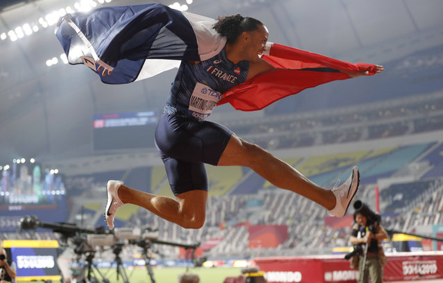 Pascal Martinot-Lagarde, of France, celebrates his bronze medal in the men's 110 meter hurdles final at the World Athletics Championships in Doha, Qatar, Wednesday, October 2, 2019. (Photo by Petr David Josek/AP Photo)