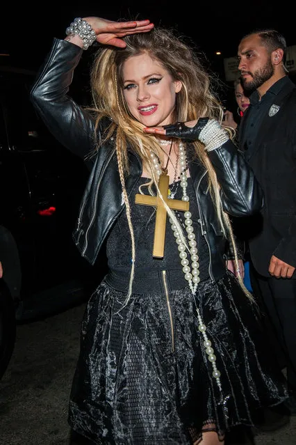 Avril Lavigne Voguing in costume as '80s Madonna at Halsey's “Almost Famous” Halloween Carnival Bash at Academy LA in Hollywood, CA. on October 25, 2019. (Photo by Backgrid USA)