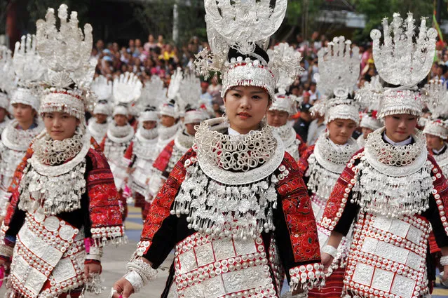 Miao nationality people wearing traditional clothes perform during the 2015 Guizhou Jianhe Yang'asha Culture Festival on July 21, 2015 in Guiyang, China. The three-day festival is held every year to commemorate Yang'asha, a beautiful lady born in a well in the legend of Miao ethnic group. (Photo by ChinaFotoPress via Getty Images)
