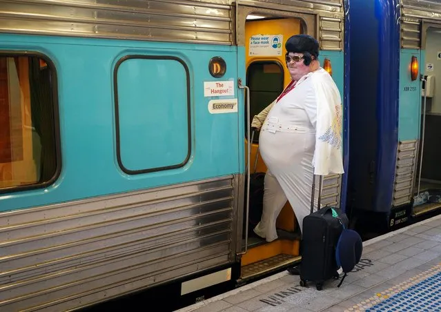 Elvis Presley impersonator Sean Wright boards a train at Sydney Central Railway Station before departing for the Parkes Elvis Festival, as the event returns following the coronavirus disease (COVID-19) pandemic, in Sydney, Australia, April 21, 2022. (Photo by Loren Elliott/Reuters)