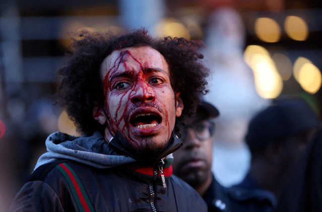 A man is detained by police officers as people protest the death of Jordan Neely, a man whose death has been ruled a homicide by the city's medical examiner after being placed in a chokehold by a fellow passenger on a New York City subway train, in New York City, U.S., May 8, 2023. (Photo by Andrew Kelly/Reuters)