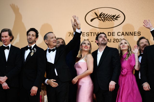 (From L) US producer Wes Anderson, US actor Adrien Brody, us actor Tom Hanks, French music composer Alexandre Desplat, US actress Scarlett Johansson, French actor Damien Bonnard, US actress Hope Davis and US actor Bryan Cranston arrive for the screening of the film “Asteroid City” during the 76th edition of the Cannes Film Festival in Cannes, southern France, on May 23, 2023. (Photo by Christophe Simon/AFP Photo)