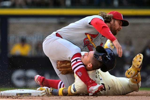 Brendan Donovan, St Louis Cardinals’ second baseman, tags out Joseph Ortiz, Milwaukee Brewers’ third baseman, at a baseball game in Milwaukee, Wisconsin on September 2, 2024. (Photo by Benny Sieu/Reuters)