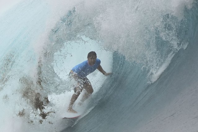 Connor O'Leary, of Japan, rides a wave during the third round of the 2024 Summer Olympics surfing competition Monday, July 29, 2024, in Teahupo'o, Tahiti. (Photo by Gregory Bull/AP Photo)