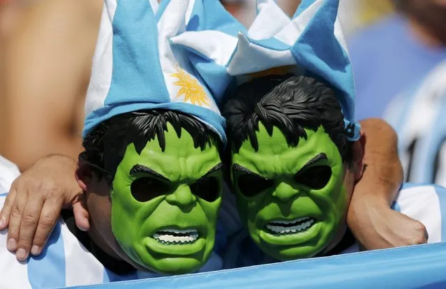 Fans of Argentina, wearing a masks of comic character the Hulk, are pictured before their 2014 World Cup Group F soccer match against Iran at the Mineirao stadium in Belo Horizonte June 21, 2014. (Photo by Sergio Moraes/Reuters)