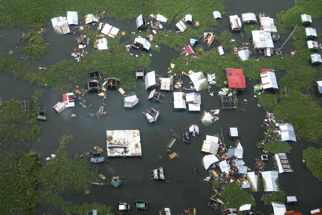 In this  photo provided by the Malacanang Presidential Communications Office, a view of damaged structures caused by Tropical Storm Trami in Laguna de Bay, Laguna province, Philippines, Friday October 25, 2024.(Photo by Malacanang Presidential Communications Office via AP Photo)