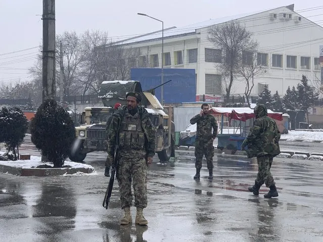 National army soldiers arrive at the site of explosion near the military academy in Kabul, Afghanistan, Tuesday, February 11, 2020. The explosion occurred early Tuesday near the military academy in a southern neighborhood of the Afghan capital, a government spokesman said. (Photo by Rahmat Gul/AP Photo)