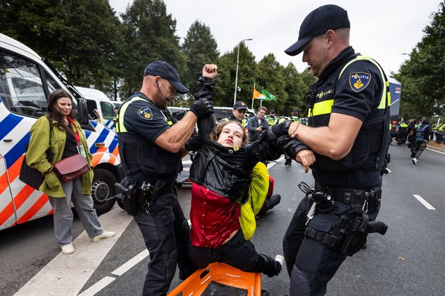 Action group Extinction Rebellion on September 19, 2023 blocked the highway for the eleventh day in a row in protest against government regulations that support the fossil industry in Netherlands. (Photo by ANP/Alamy Live News)