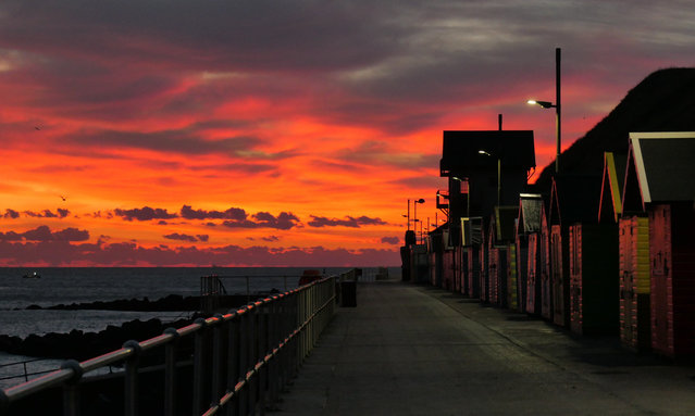 Fiery skies in the east shortly before sunrise on 6 October 2024, as seen from the east promenade in Sheringham, Norfolk, UK. (Photo by Chris Doward /The Guardian)