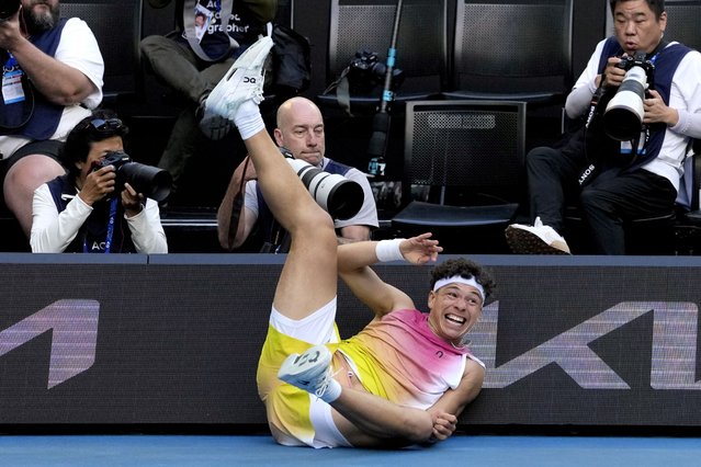 Ben Shelton of the U.S. falls into signboards after a fall during his quarterfinal match against Lorenzo Sonego of Italy at the Australian Open tennis championship in Melbourne, Australia, Wednesday, January 22, 2025. (Photo by Ng Han Guan/AP Photo)