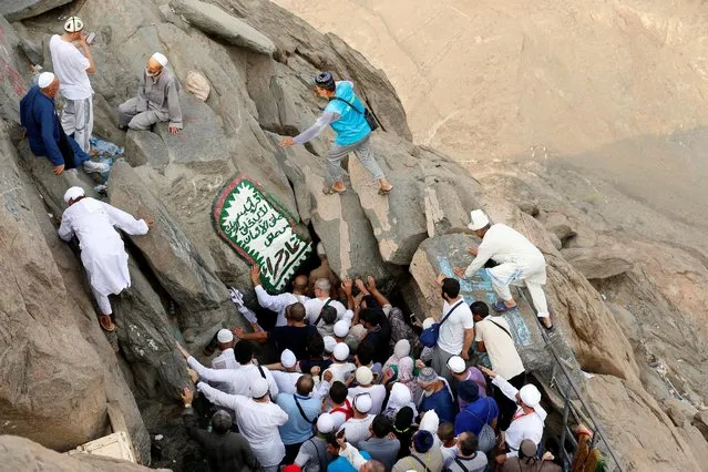 Muslim pilgrims visit the Hera cave, where Muslims believe Prophet Mohammad received the first words of the Koran through Gabriel, at the top of Mount Al-Noor, ahead of the annual haj pilgrimage in the holy city of Mecca, Saudi Arabia September 7, 2016. (Photo by Ahmed Jadallah/Reuters)