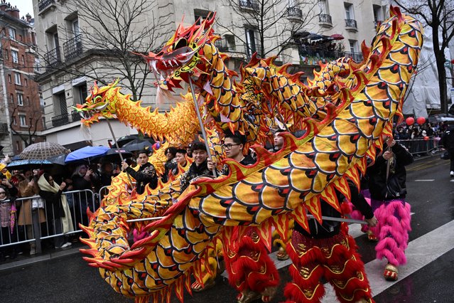 Members of the Chinese community take part in a parade celebrating the Chinese Lunar New Year in Paris on February 18, 2024. (Photo by Bertrand Guay/AFP Photo)
