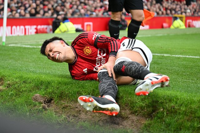 Lisandro Martinez of Manchester United goes down with an injury during the Premier League match between Manchester United and West Ham United at Old Trafford on February 04, 2024 in Manchester, England. (Photo by Michael Regan/Getty Images)
