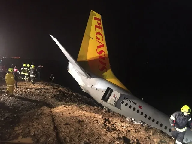 A Pegasus airplane carrying 162 passengers is seen stuck in mud as it skidded off the runway after landing in Trabzon Airport, Turkey early Sunday on January 14, 2018. (Photo by Tugba Yardimci/Anadolu Agency/Getty Images)