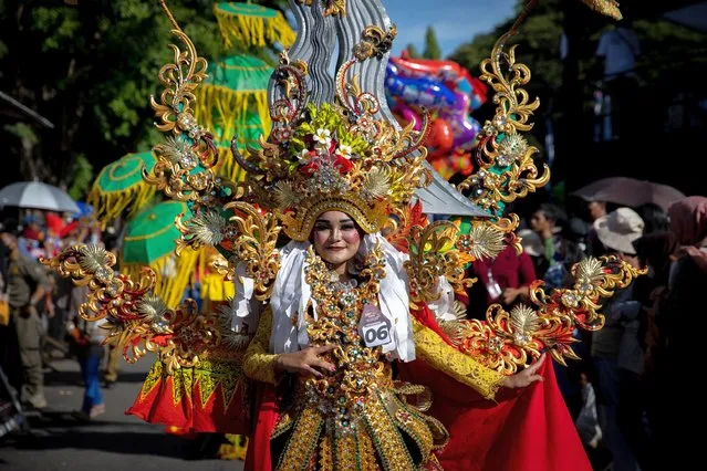 A model performs during the Madurese defile in the Banyuwangi Ethno Carnival – Reborn 2022 on December 10, 2022 in Banyuwangi, Indonesia. (Photo by Robertus Pudyanto/Getty Images)