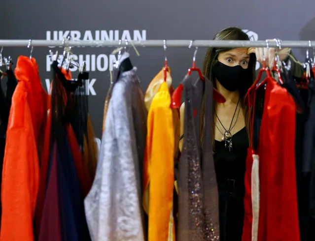 A model waits backstage at the Ukrainian Fashion Week in Kyiv, Ukraine on August 31, 2020. (Photo by Gleb Garanich/Reuters)