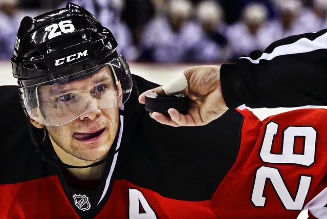 New Jersey Devils left wing Patrik Elias of the Czech Republic, eyes the puck before it is dropped on the ice during the second period of an NHL hockey game against the Tampa Bay Lightning, in Newark, New Jersey, on February 7, 2013.The Devils won 4–2. (Photo by Julio Cortez/Associated Press)