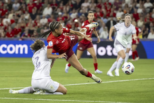 Norway's Marit Bratberg Lund, left, battles for the ball with Switzerland's Iman Beney, right, during the Euro 2025 Group A soccer match between Switzerland and Norway at the St. Jakob-Park stadium in Basel, Switzerland, Wednesday, July 2, 2025. (Photo by Georgios Kefalas/Keystone via AP Photo)