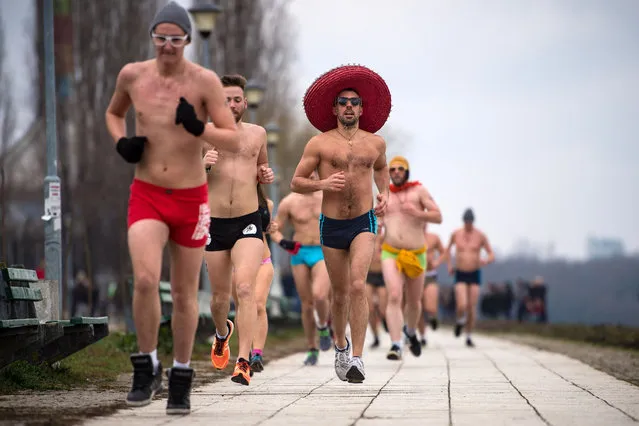 Runners take part in an Underpants Run on the banks of Danube river in Belgrade on February 4, 2018, while outside temperature approaches zero degree Celsius. (Photo by  Andrej Isaković/AFP Photo)
