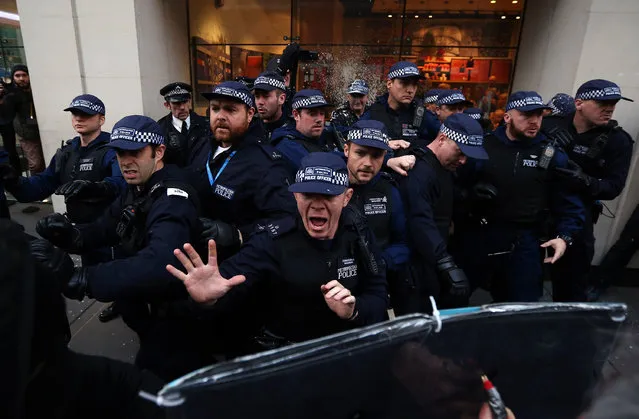 Police officers shout at protesters during a demonstration against fees and cuts in the education system on November 19, 2014 in London, England. A coalition of student groups have organised a day of nationwide protests in support of free education and to campaign against cuts. (Photo by Carl Court/Getty Images)