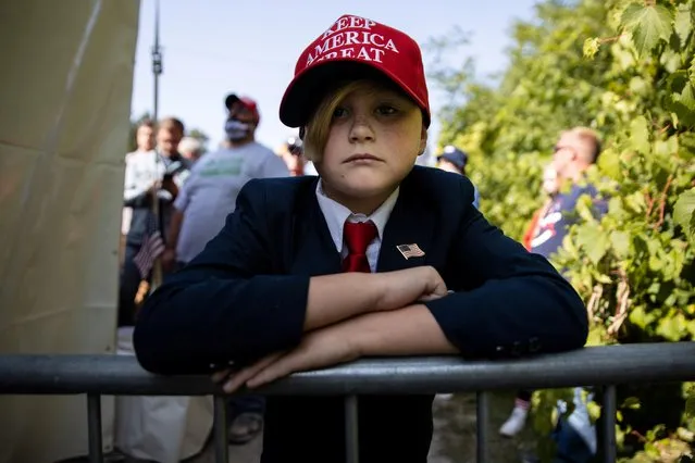 A young Trump supporter waits outside of a campaign rally for U.S. President Donald Trump in Toledo, Ohio, U.S., September 21, 2020. (Photo by Megan Jelinger/Reuters)