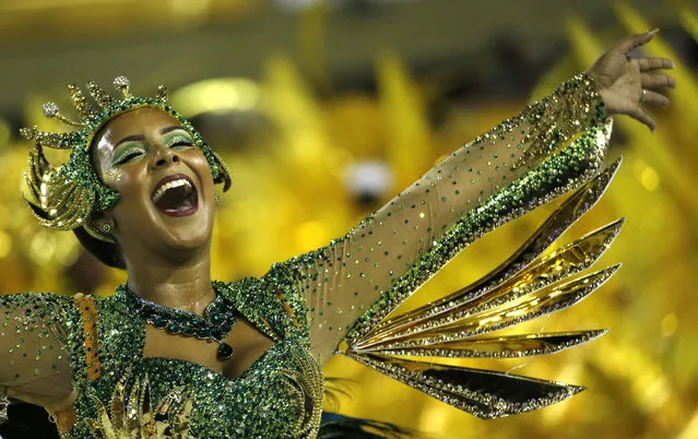 A performer from the  Império Serrano samba school parades during Carnival celebrations at the Sambadrome in Rio de Janeiro, Brazil, Sunday, February 11, 2018. (Photo by Silvia Izquierdo/AP Photo)