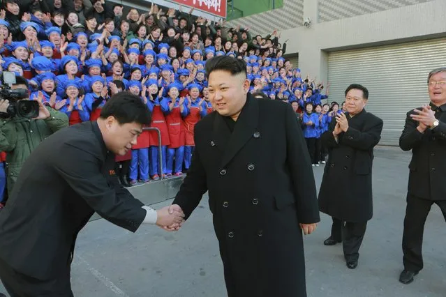 North Korean leader Kim Jong Un (C) visits Kumkop General Foodstuff Factory for Sportspersons in this undated photo released by North Korea's Korean Central News Agency (KCNA) in Pyongyang January 18, 2015. (Photo by Reuters/KCNA)