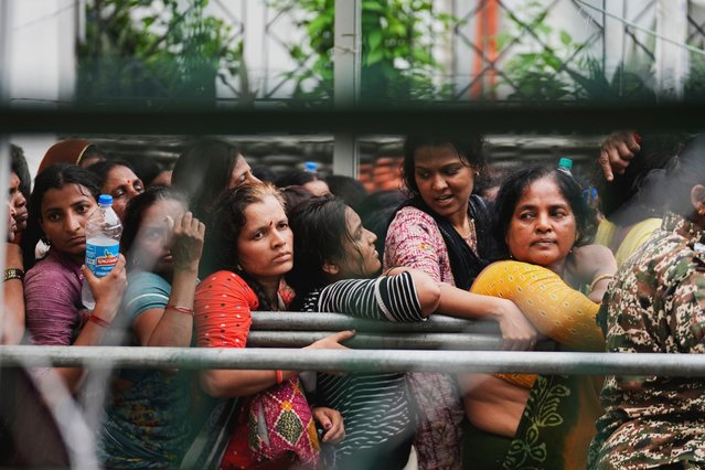 Pilgrims headed to the Himalayan shrine of Amarnath wait in a queue outside a registration counter in Jammu, India, Tuesday, July 1, 2025. (Photo by Channi Anand/AP Photo)
