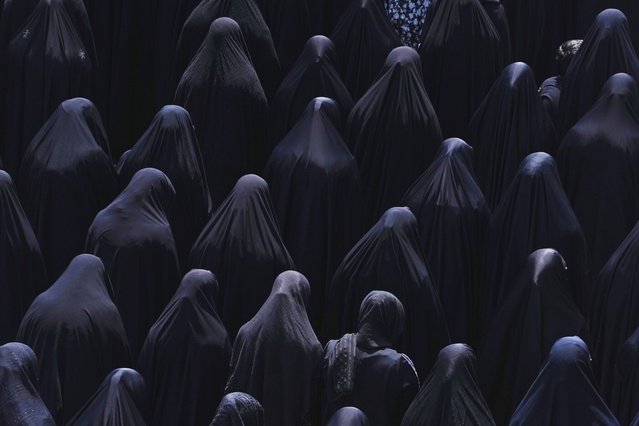 Shiite Muslim women pray at the shrine of Saint Abdulazim in Shahr-e-Ray, south of Tehran, Iran, August 14, 2025, during a ceremony to observe the Arbaeen, which marks the anniversary of the 40th day of mourning following the 7th century death of the Prophet Muhammad's grandson Hussein, who was killed in a battle in Karbala in present-day Iraq. (Photo by Vahid Salemi/AP Photo)