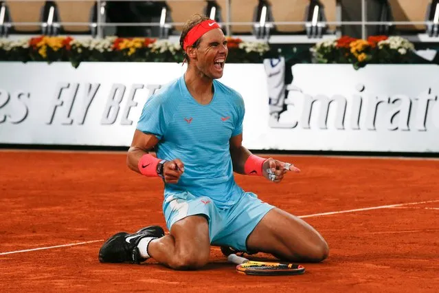 Spain's Rafael Nadal celebrates winning the final match of the French Open tennis tournament against Serbia's Novak Djokovic in three sets, 6-0, 6-2, 7-5, at the Roland Garros stadium in Paris, France, Sunday, October 11, 2020. (Photo by Michel Euler/AP Photo)