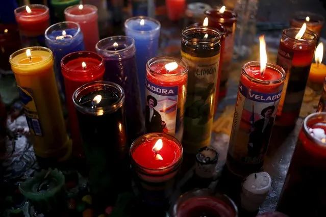 Candles are lit inside San Simon church in Iztapa, in Chimaltenango, around 62 km (39 miles), from Guatemala City, October 28, 2015. (Photo by Jorge Dan Lopez/Reuters)