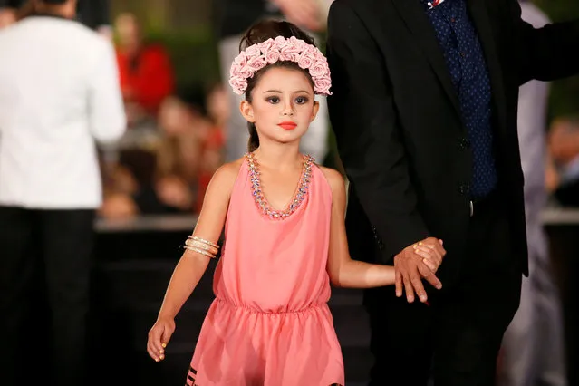 Dinorah Valentina Hernandez, daughter of Venezuelan-born former Miss Universe Alicia Machado, who was the subject of criticism over Twitter by Republican presidential candidate Donald Trump, models a creation by costume designer Ricardo Soltero during the Metropolitan Fashion Week's Closing Gala & Awards Show at Warner Brothers Studios in Burbank, California, U.S. October 1, 2016. (Photo by Danny Moloshok/Reuters)