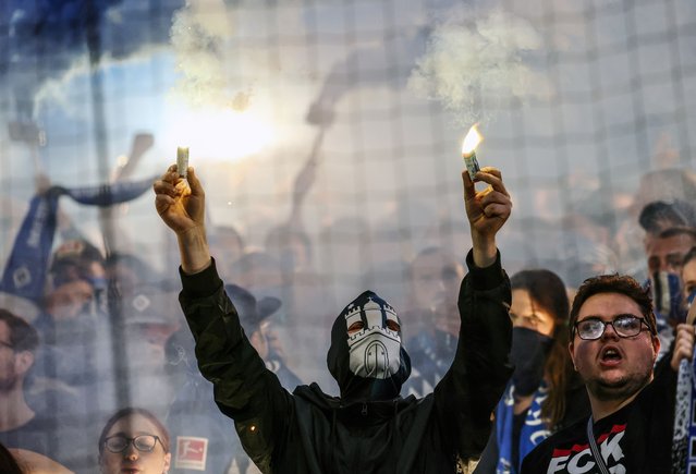 Fans of Hamburger SV burn flares during the Bundesliga soccer match between Hamburger SV and FC St. Pauli, in Hamburg, Germany, 29 August 2025. (Photo by Hannibal Hanschke/EPA)
