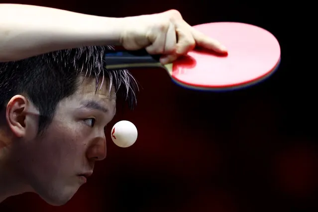 Fan Zhendong of China serves against compatriot Wang Chuqin in their men's singles semifinal during the WTT Singapore Smash at the OCBC Arena on March 18, 2023 in Singapore. (Photo by Yong Teck Lim/Getty Images)