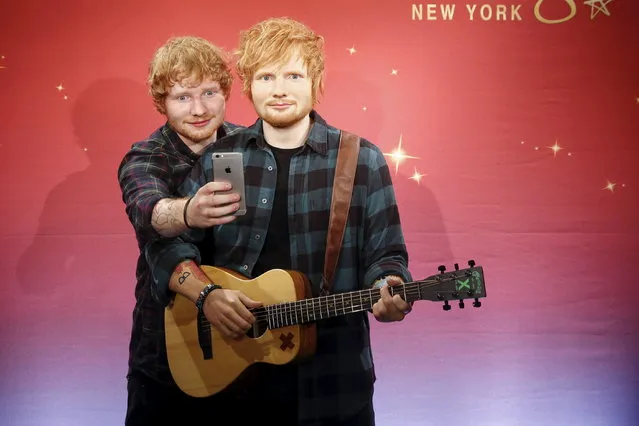 Ed Sheeran takes a “selfie” with his wax figure at Madame Tussauds museum in Manhattan, May 28, 2015. (Photo by Shannon Stapleton/Reuters)