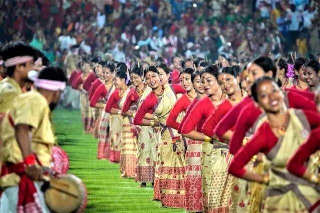 Assamese dancers in traditional attire perform as they attempt Guinness World Record in the largest folk dance performance category in Guwahati, India, Friday, April 14, 2023. (Photo by Anupam Nath/AP Photo)