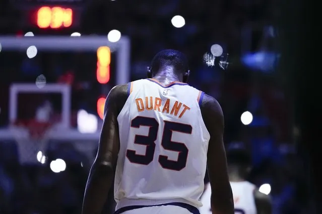 Phoenix Suns forward Kevin Durant (35) walks on the court during a timeout in the second half of Game 3 of a first-round NBA basketball playoff series against the Los Angeles Clippers in Los Angeles, Thursday, April 20, 2023. (Photo by Ashley Landis/AP Photo)