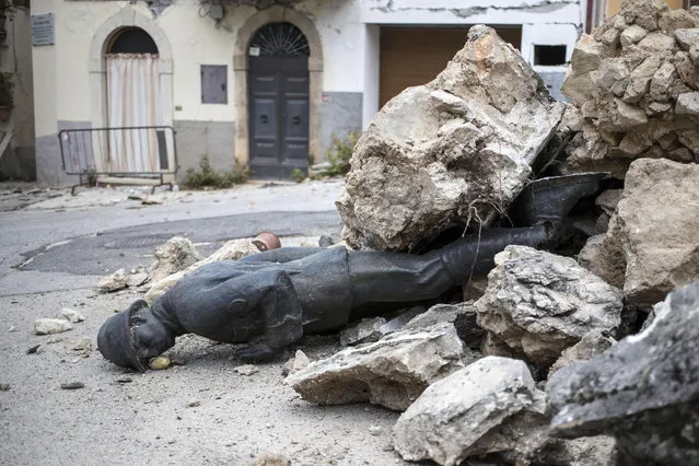 An unknown soldier monument is buried in rubbles after the strong quake devasted central Italy in San Pellegrino di Norcia, 02 November 2016. Aftershocks continue to keep people on edge in the areas of central Italy devastated by a series of recent earthquakes, including 30 October 6.5-magnitude quake near Norcia. (Photo by Massimo Percossi/EPA)