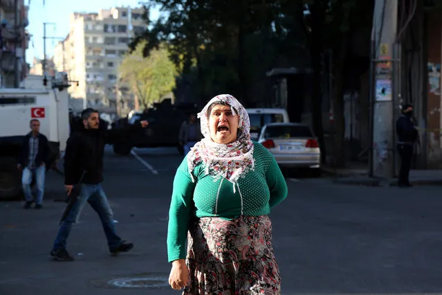 A woman reacts after a blast in the Kurdish-dominated southeastern city of Diyarbakir, Turkey, November 4, 2016. (Photo by Sertac Kayar/Reuters)