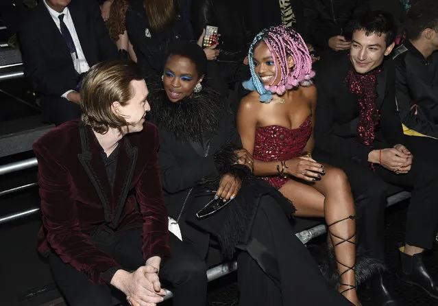 Actor Caleb Landry Jones, singer Lauryn Hill, Selah Marley and actor Ezra Miller, from left, attend the Saint Laurent Spring/Summer 2019 Menswear Collection at Liberty State Park on Wednesday, June 6, 2018, in Jersey City, N.J. (Photo by Evan Agostini/Invision/AP Photo)