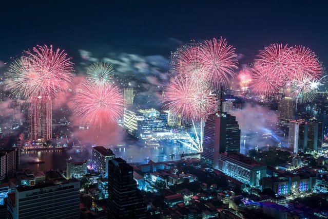 Fireworks explode during New Year celebrations in Bangkok, Thailand, on January 1, 2025. (Photo by Patipat Janthong/Reuters)