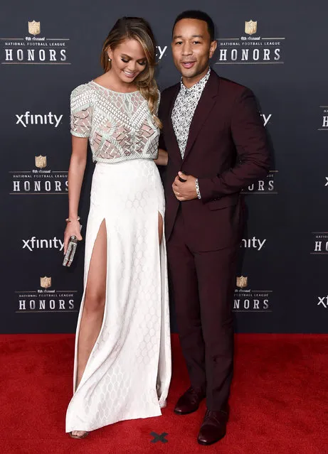 Chrissy Teigen, left, and John Legend arrive at the 4th annual NFL Honors at the Phoenix Convention Center Symphony Hall on Saturday, January 31, 2015. (Photo by Jordan Strauss/Invision for NFL/AP Images)