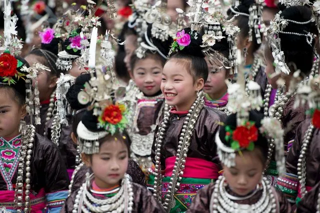 Ethnic Dong children wearing traditional costumes participate in a singing contest in Rongjiang, Guizhou province, December 18, 2015. (Photo by Reuters/Stringer)